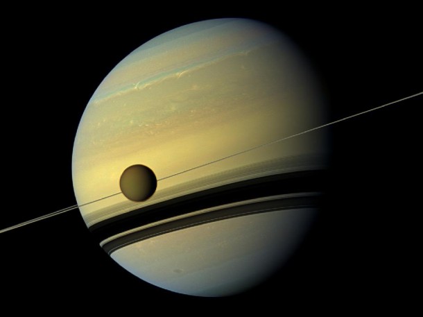 A mosaic of images of Saturn and its moon, Titan, taken by NASA's Cassini spacecraft. Seasons have changed on Saturn, the azure blue in the planet’s northern hemisphere is now fading while the southern hemisphere is now taking on a bluish hue. Scientists say these changes are likely due to the reduced intensity of ultraviolet light and the haze it produces in the southern hemisphere as winter approaches, and the increasing intensity of ultraviolet light and haze production in the northern hemisphere as summer approaches. (Photo: NASA)