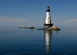 Rock of Ages Lighthouse stands on a strip of exposed rock near Isle Royale on Lake Superior.