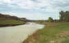 People crossing the Little Missouri River at the north boundary of the South Unit of Theodore Roosevelt National Park