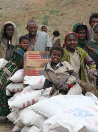 adults and children at a food distribution point