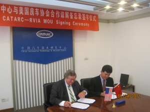 RVIA President Richard Coon signs CATARC agreement. (Photo RVIA)