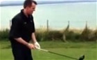 England spinner Graeme Swann demonstrates his golfing skills using Jimmy Anderson's custom-made driver, with the unexpected result caught on camera by Stuart Broad. 