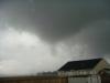 Photo of tornado touchdown in a field looking northwest toward Braxton Road - photo courtesy of Cheryl Jones and Steve Collins - Click to enlarge