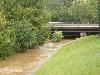 Photo looking southeast toward Glenwood Avenue of a flooded Crabtree Creek that covers the Crabtree Valley Greenway with several feet of water - photo courtesy of the National Weather Service - Click to enlarge