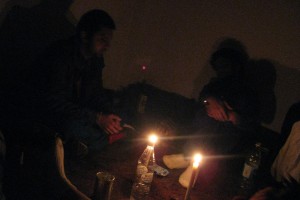 people sitting by candlelight