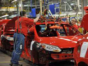 Ford Motor Company employees at the Michigan Assembly Plant in Wayne, MI assemble a 2012 Ford Focus.