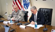 Army Secretary John McHugh signs a directive for the development of a "Ready and Resilient" campaign on Joint Base Lewis-McChord, Wash., Feb. 4, 2013. The campaign will integrate and synchronize the multiple efforts and programs designed to improve the readiness and resilience of soldiers, Army civilians and their families. U.S. Army photo by Spc. John G. Martinez