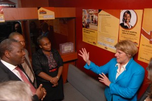 OPIC President & CEO Elizabeth Littlefield, Equity Bank founder James Mwangi (far left) and other bank representatives visit a branch in Nairobi, Kenya