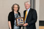 ARL Director John Miller accepts a plaque from Dr. Rose Pesce-Rodriguez, ARL Fellow Co-Chair, after he was designated an Honorary ARL Fellow on May 25.