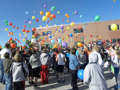 Freeman Public Schools students release balloons after making their pledge against bullying.