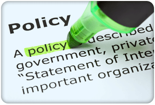 Close-up photo of a page of text with the word Policy highlighted in green