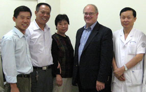 Sieving with Dr. Chen Song (r) of Tianjin Eye Hospital and the patient's family