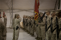 Colonel James Hanlon (center front) commanding officer, I Marine Expeditionary Force Headquarters Group (Forward), and Sgt. Maj. Kenneth Rocquemore, sergeant major, I MHG (Fwd), render salutes during a transfer of authority ceremony aboard Camp Leatherneck, Afghanistan, Jan. 24, 2013. The unit oversaw the beginning of the retrograde and redistribution process in Helmand province, Afghanistan.