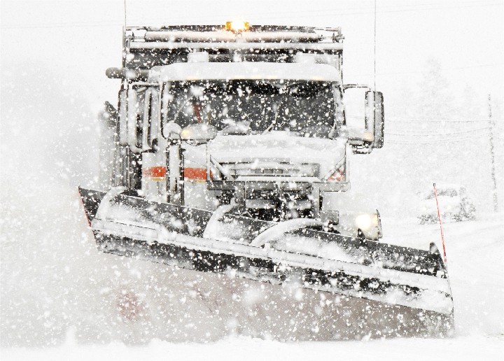 Cover Photo: Truck plowing snow.
