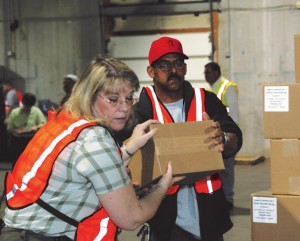 Health department staff moving boxes of medical supplies