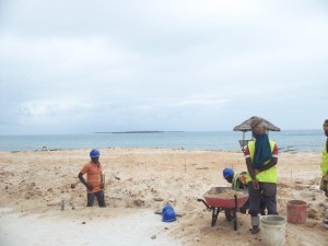 Workers at the construction site of a new hotel on the Tanzanian coastline outside Dar es Salaam