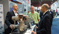 Ambassador Jacobson speaks with delegates at the U.S. Pavilion during GO Expo 2011 in Calgary. (Credit: US Consulate Calgary) 