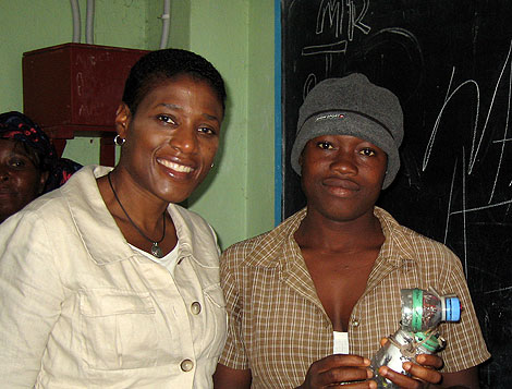 MCC Senior Advisor Cassandra Butts visits with Liberian school girls in the King Gray community about educational opportunities for both school age youth and older youth who missed traditional schooling because of the country’s conflict.