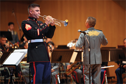 Sgt. Christopher C. Calamari, a member of the III Marine Expeditionary Force Band, performs a trumpet solo during a combined concert in Sendai, Japan, Sept. 24, with members of the Japan Ground Self-Defense Force Central Band, Japan Maritime Self-Defense Force Central Band and the U.S. Army Japan Band.