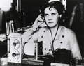 An employee of the National Bureau of Standards listens t a radio broadcast picked up by one of the first homemade crystal detector sets 