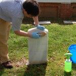 Jason Church demonstrates the proper technique for cleaning a marble headstone using a biocidal cleaner, water, and a soft bristle brush.