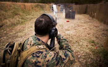 Sgt. John R. Browning, an instructor and competitor with the Marine Corps Combat Shooting Team, fires a Benelli M1014 Joint Service Combat Shotgun at targets while running through a three-gun scenario, switching from pistol to rifle to shotgun, at the High Risk Personnel Range at the Calvin A. Lloyd Range Complex at Marine Corps Base Quantico, Va. The combat team has only existed for a few years and is now finding its place in the Corps. Seven Marines, all with an infantry background, serve on the team where they represent the Marine Corps in shooting competitions, as well as test combat techniques and instruct combat marksmanship. (U.S. Marine Corps photo by Sgt. Mark Fayloga)