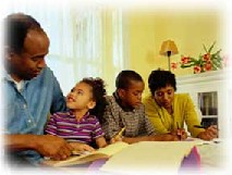 An Image of Two Parents Studying With Their Two Children