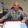 Capt. Brian Forshee, outgoing commander, HHC, USAG, sits at his desk during a typical workday Jan. 8 on Main Post. Forshee relinquished his duties as the commander of HHC, USAG, during a Jan. 16 change of command ceremony. He will now return to his roots with the 1st Bn., 5th FA Regt.  Photo by: Julie Fiedler, POST.