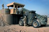 HELMAND PROVINCE, Afghanistan (March 29, 2009) - U.S. Navy Seabees use a forklift to place a guard tower between barriers during a project in Helmand province, Afghanistan, March 20, 2009. Seabees of Naval Mobile Construction Battalion-5 are deployed to Afghanistan providing contingency construction support to allies and members of the NATO International Security Assistance Force. Photo by Petty Officer 2nd Class Patrick W. Mullen III, U.S. Navy.