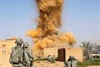 SHUZAYF, Iraq (March 30, 2009) - U.S. Army soldiers destroy a building used as an insurgent hideout with high explosives in Shuzayf, Iraq, March 26, 2009. The soldiers are assigned to the 25th Infantry Division's 1st Battalion, 24th Infantry Regiment, 1st Stryker Brigade Combat Team. Photo by Petty Officer 2nd Class Walter J. Pels, U.S. Navy.
