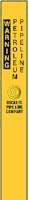 Yellow pipeline marker showing the words: "WARNING PETROLEUM PIPELINE"