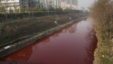 A view of red polluted water in the Jianhe River in Luoyang, Henan province, December 13, 2011. According to local media, the sources of the pollution are two illegal chemical plants discharging their production waste water into the rain sewer pipes. 