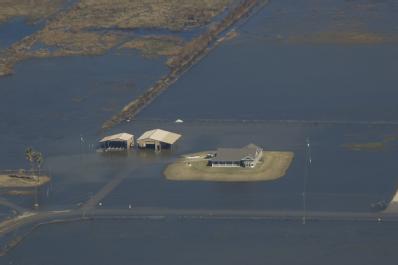 Photo of a few houses in a flooded area