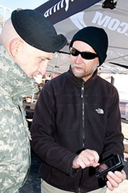 ARL meteorologist Dave Sauter explains a handheld mobile weather device technology that could provide critical weather and heat stress intelligence to Maj. Gen Nickolas G. Justice, Research, Development and Engineering Command commander, at the All-American Bowl in San Antonio.