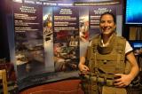 NSWC Dahlgren Human Systems Engineer Rachael Lund wears a Modular Tactical Vest (MTV) used in support of ongoing Human System Integration efforts at the Surface Navy Symposium in Arlington, Va. Jan. 11.