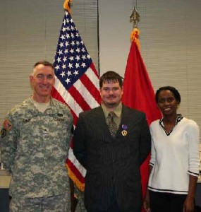 (L-R) BG Gary Cheek, WTC Commander, AW2 Veteran Mike Timm, and AW2 Advocate Yan Barry at the Purple Heart ceremony.