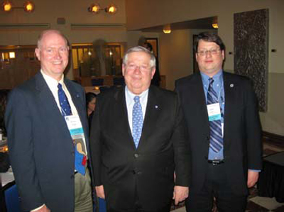 Massachusetts State Senator Richard Moore is flanked by conference co-planners Mike Coplen of FRA and Stephen Popkin of the Volpe Center. (Volpe Center photo)