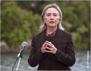 Hillary Rodham Clinton at microphone outdoors (AP Images)