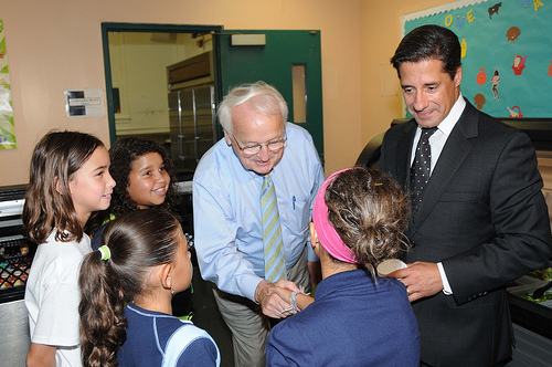 US Kevin Concannon and Miami-Dade County School Superintendent Alberto Carvalho talk with students from North Beach Elementary School, Miami, FL, on August 23, 2012, during lunch.  (USDA photo by Debbie Smoot).