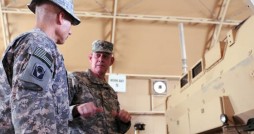 Col. Rafael Ribas (left), commander of 2nd Battalion, 124th Infantry Regiment, 53rd Infantry Brigade Combat Team, at Camp Virginia, Kuwait, discusses the Mine Resistant Ambush Protected vehicles belonging to his unit with Brig. Gen. James Tyre, Chief of Staff for the Florida Army National Guard, May 12. Tyre took a tour of Kuwait to visit the 53rd IBCT along with state Command Sgt. Maj. Robert Hosford. Courtesy photo