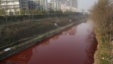 A view of red polluted water in the Jianhe River in Luoyang, Henan province, China, December 13, 2011. According to local media, the sources of the pollution are two illegal chemical plants discharging their production waste water into the rain sewer pipes. 