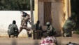 Malian soldiers fire at Islamists' positions at the mayor's office, in Gao, Mali, February 21, 2013.