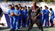 FILE - Lamar Odom of NBA basketball team Los Angeles Clippers shows a group of children how to pass the ball during a coaching clinic at the Huangzhuang School in Beijing, China, Oct. 10, 2012. 