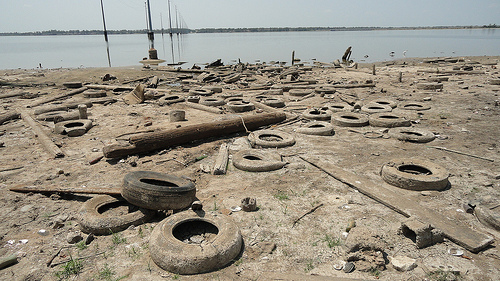 tires, litter on shoreline
