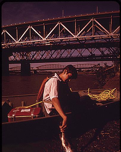 dying fish at the inner city viaduct area joining Kansas City, KS, and Kansas City, MO. June 1973 by Kenneth Paik.