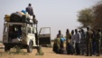 Malian people are controlled by Malian soldiers at a check point on February 23, 2013 in the center of northern Mali's largest city of Gao. 