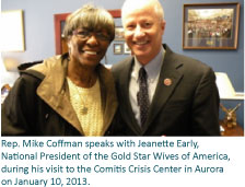 Rep. Mike Coffman speaks with Jeanette Early, National President of the Gold Star Wives of America, during his visit to the Comitis Crisis Center in Aurora on January 10, 2013.