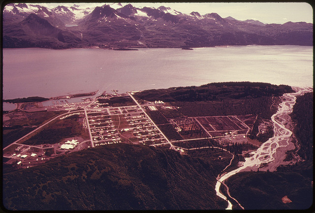 DOCUMERICA: View South Across Port Valdez From New Townsite to Pipeline Terminus and Site of Deepwater Tanker Loading Facilities...08/1974 by Dennis Cowals.