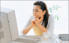 Photo of a woman sitting at her workstation