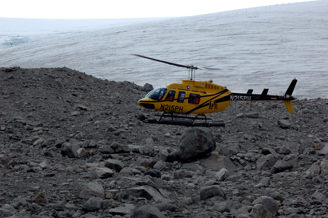 Helicopter lands behind Palmer Station.